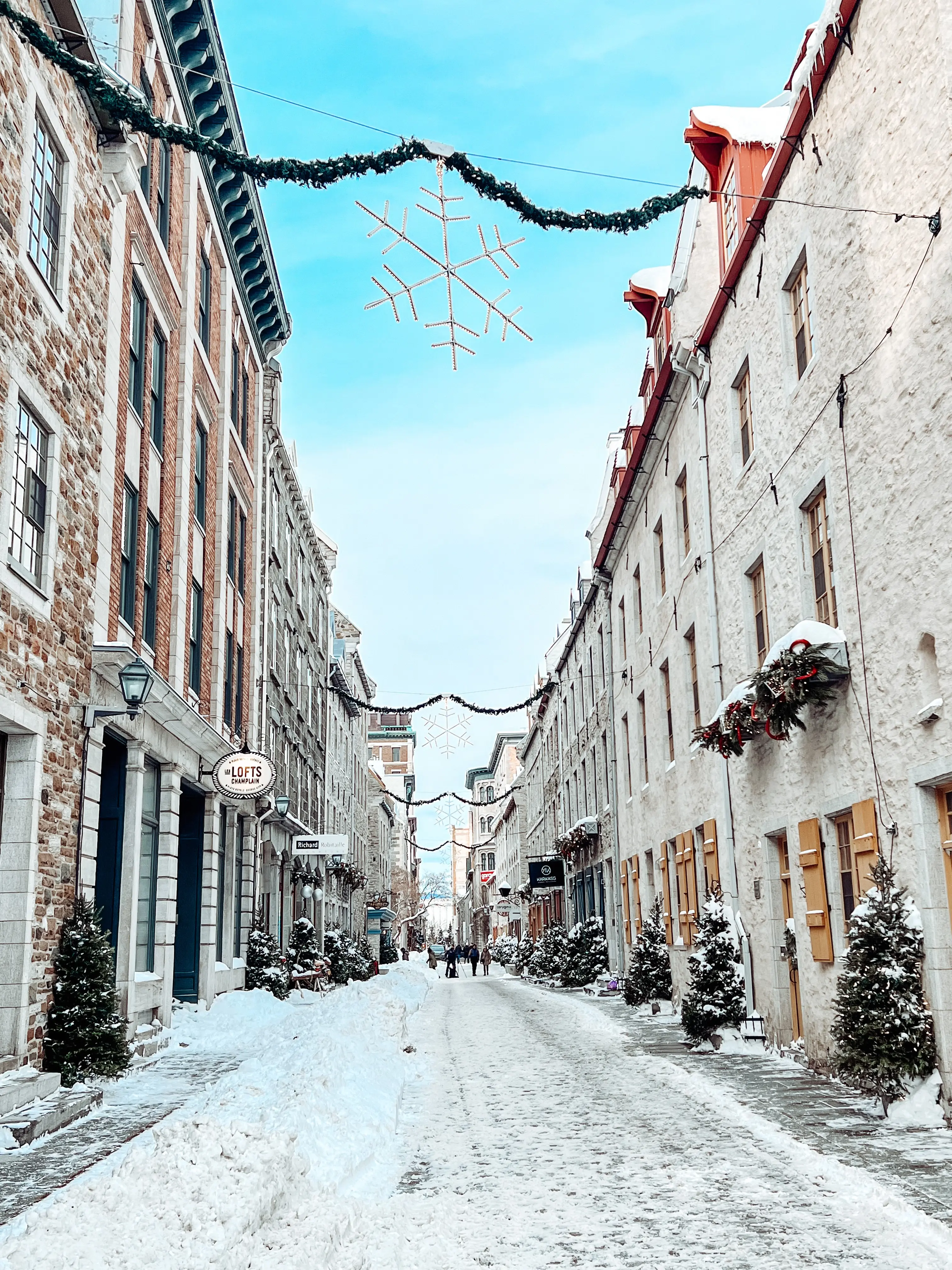 Outdoor image of city streets decorated for Christmas, in Quebec City.