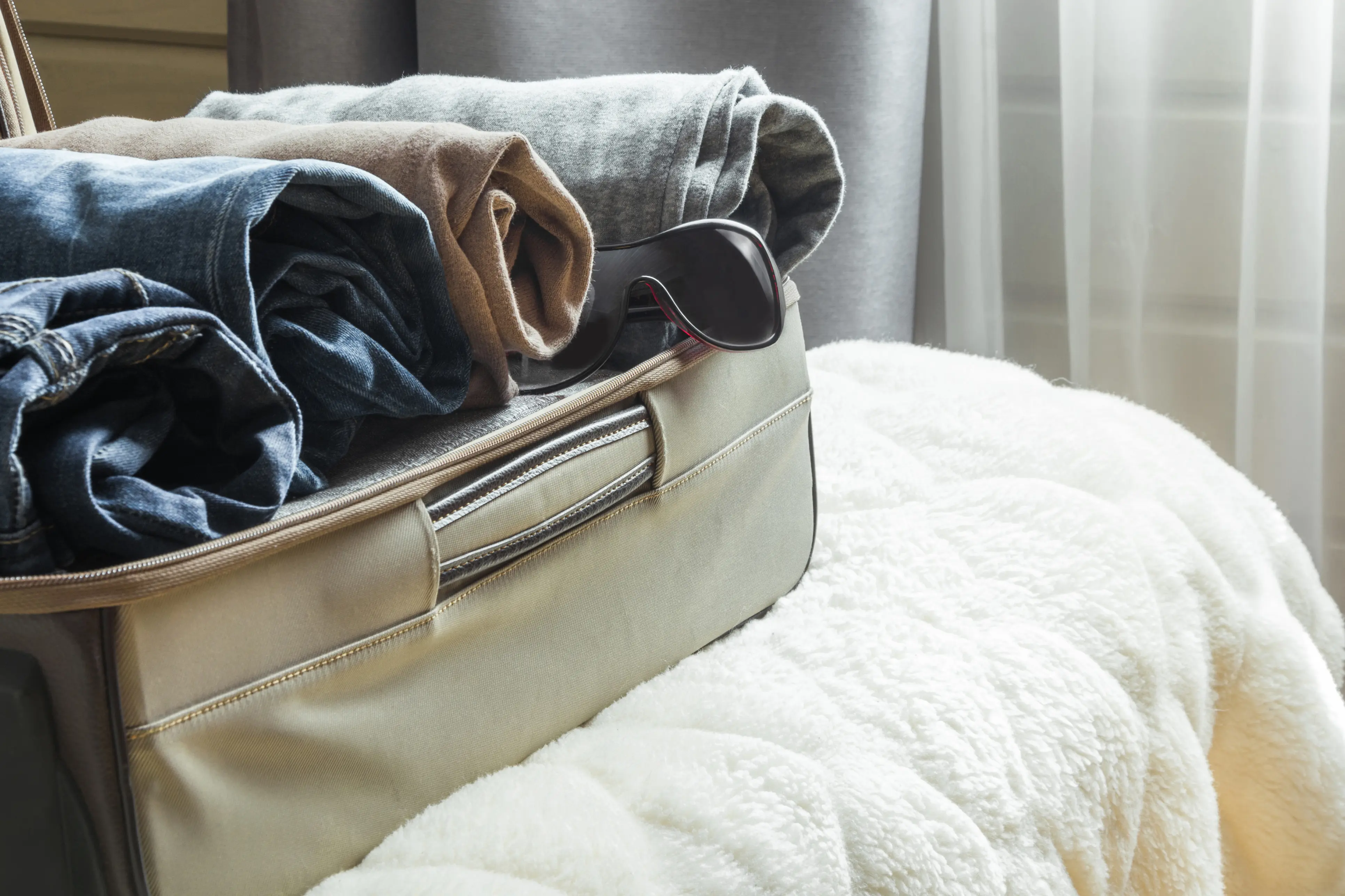 Suitcase with rolled clothing