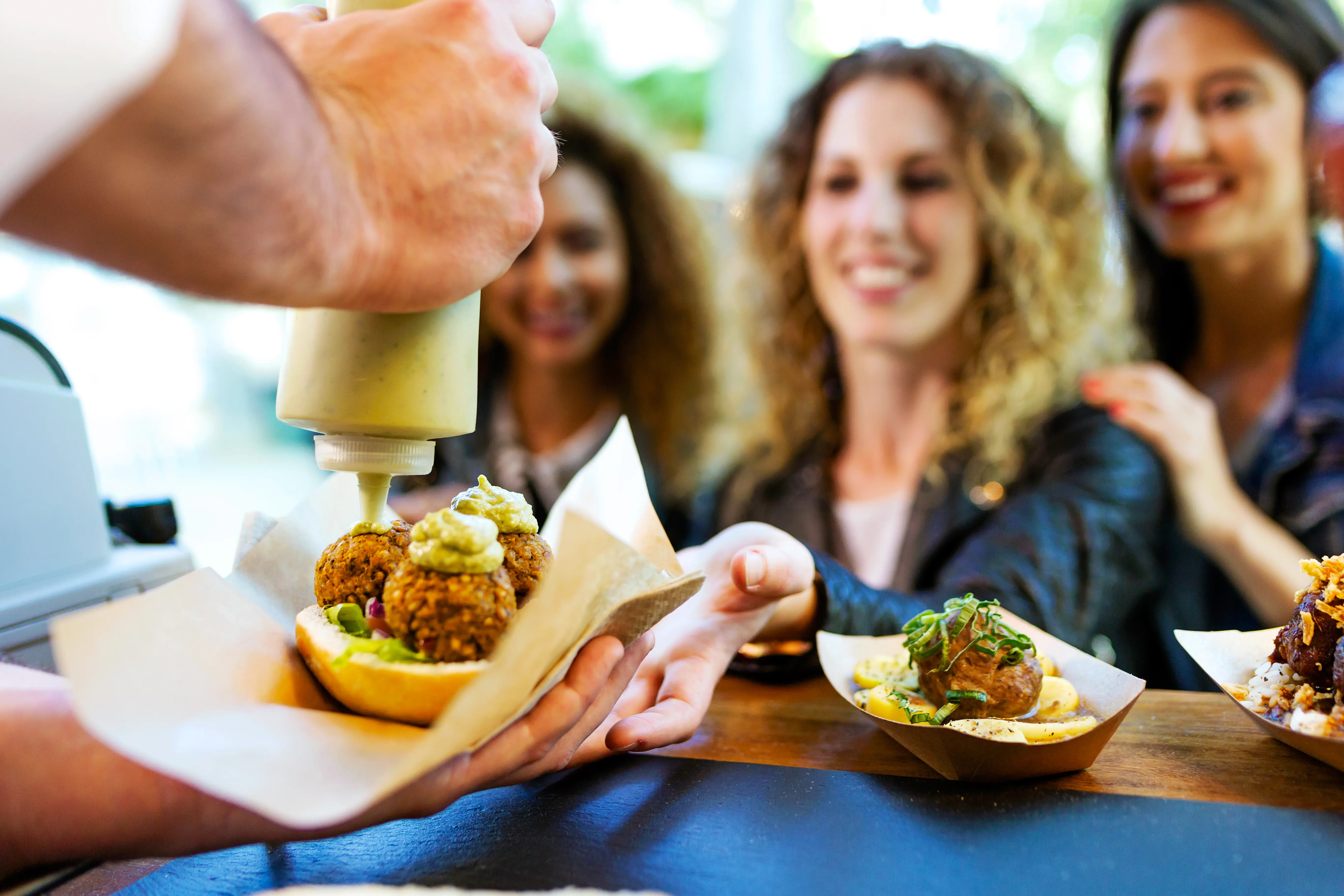 Tourists enjoying a food tour