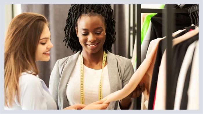 Two women are shown looking at clothes during a personal styling session.