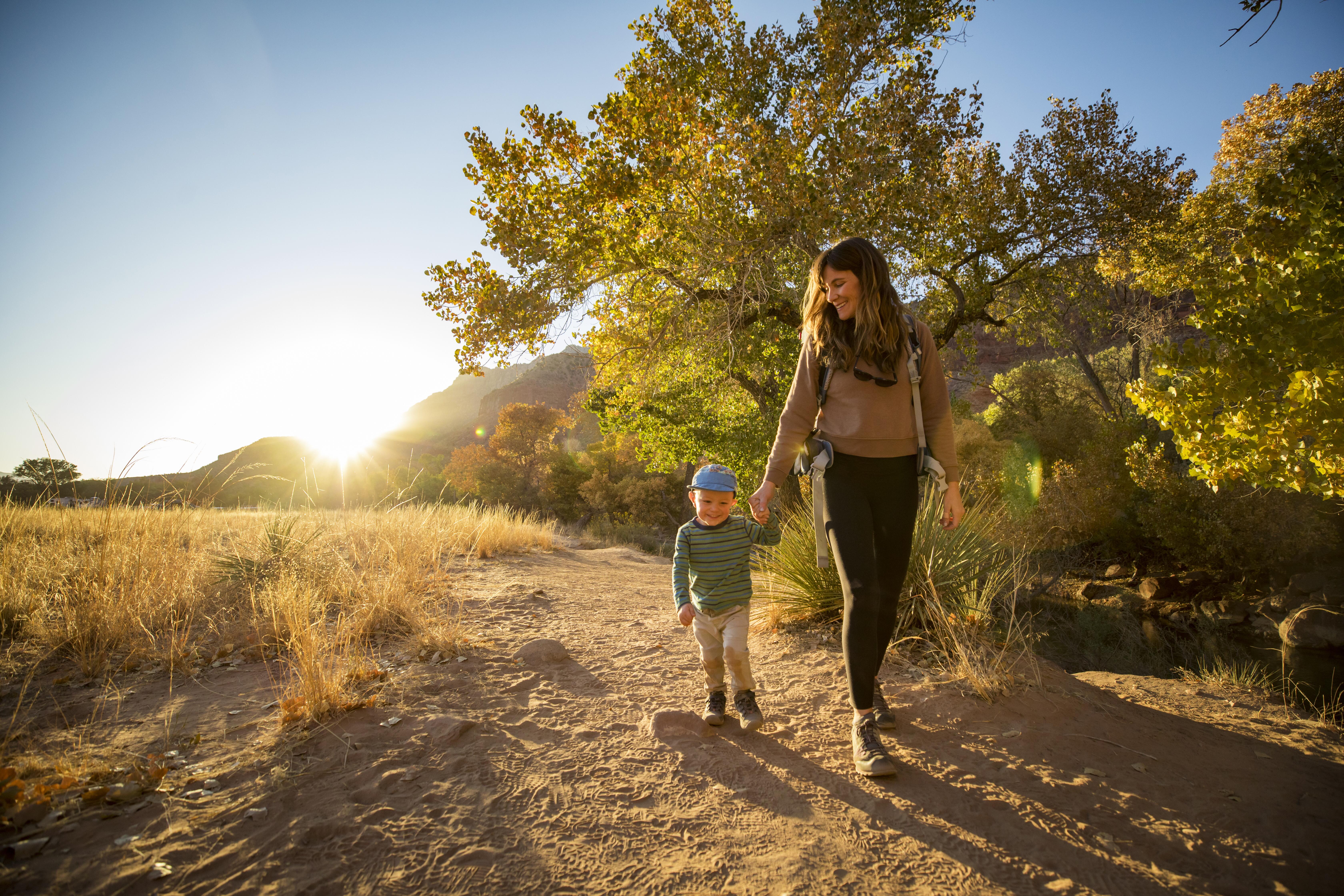 Outdoor image of woman and child walking on a Utah trail.