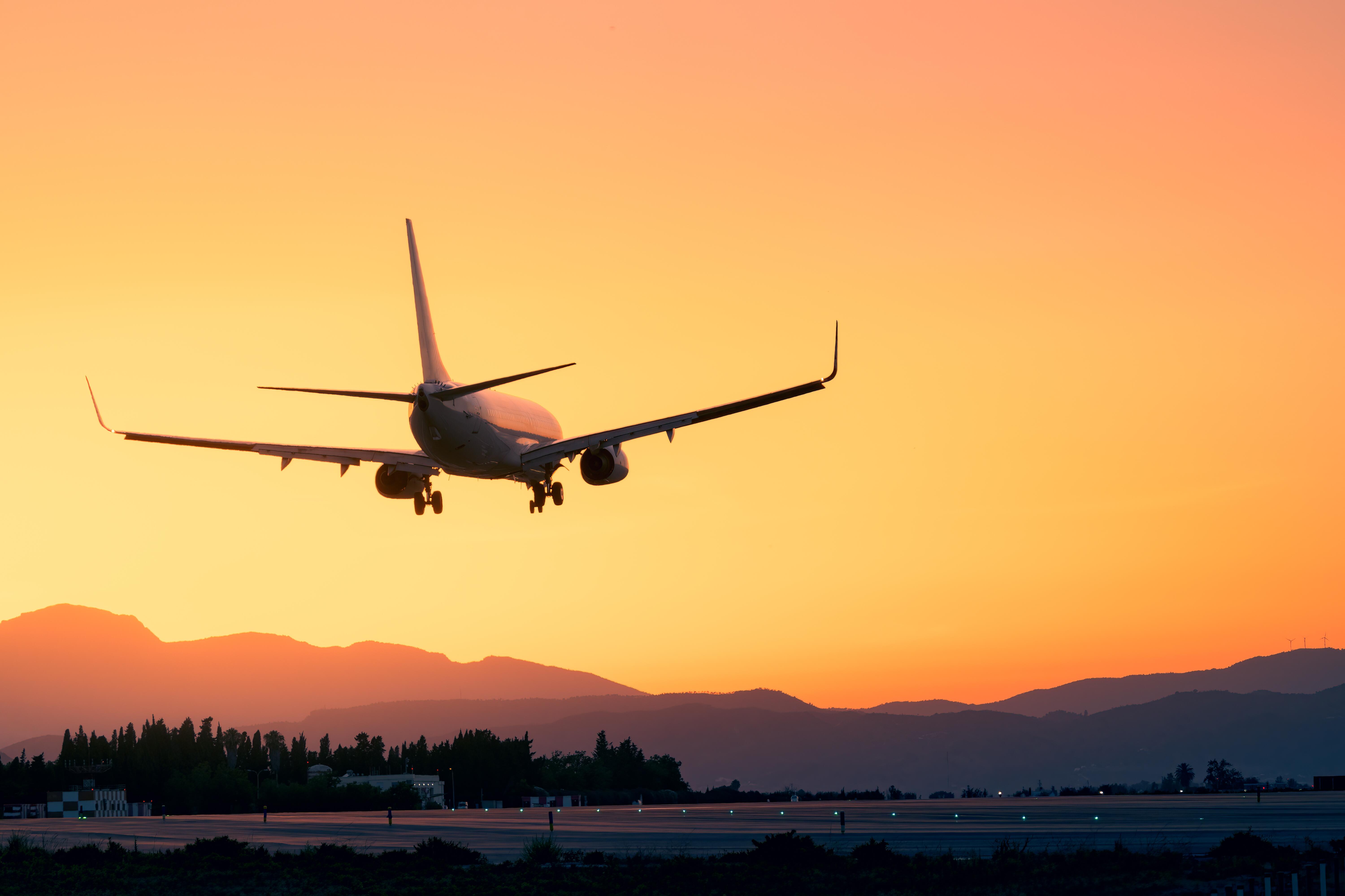 Photo of an airplane during sunset