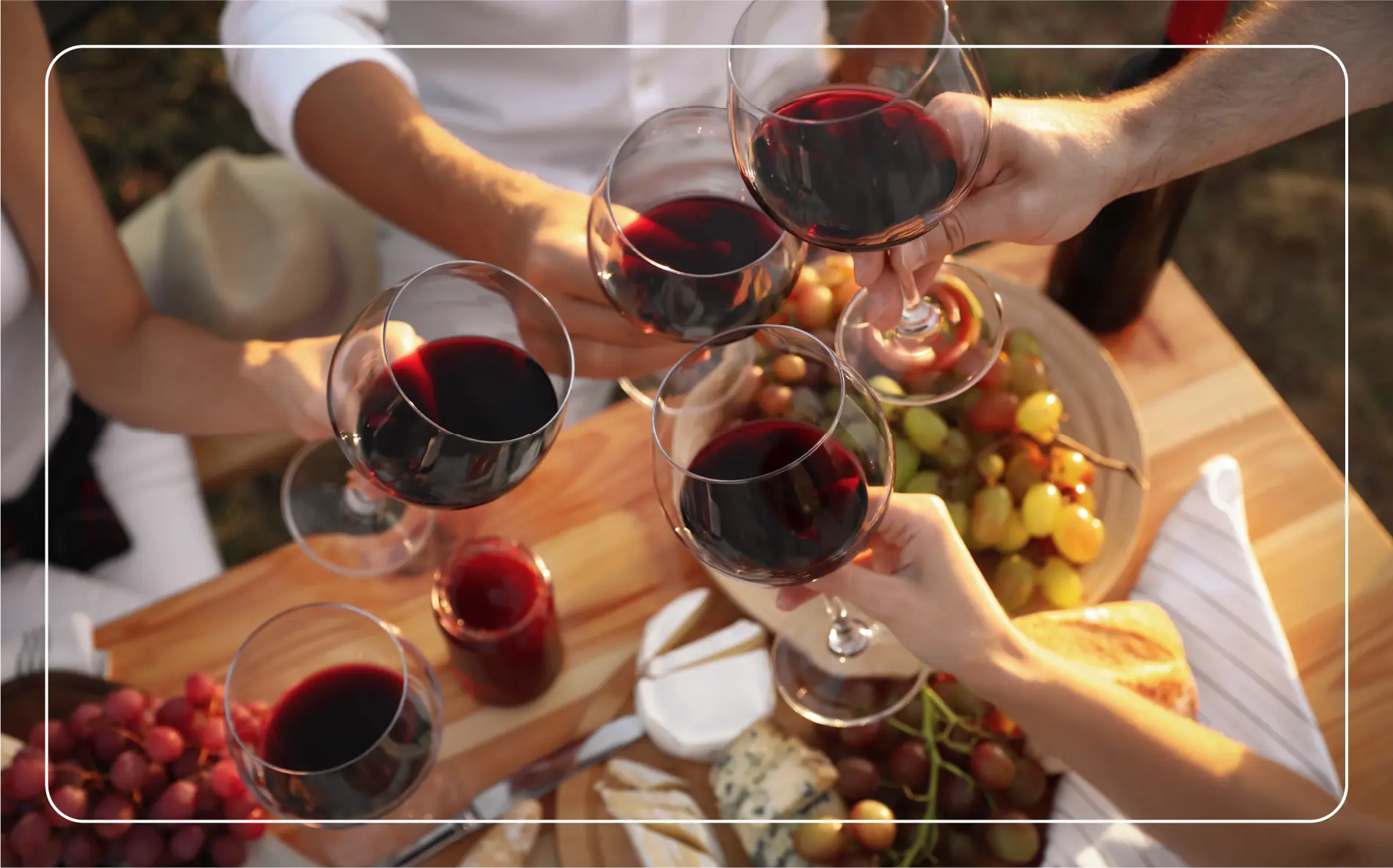 People toasting wine glasses at the Italian Grape Harvest Festival.