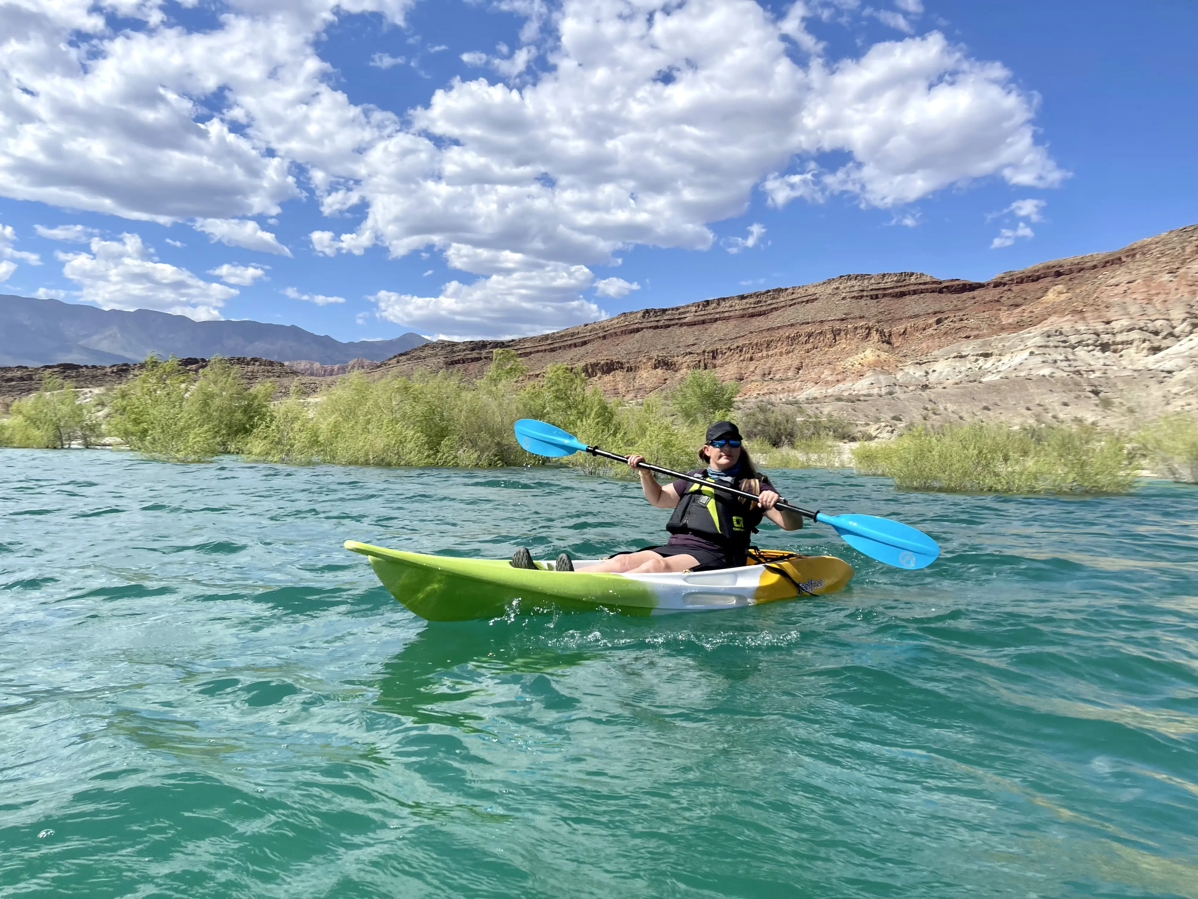 Image of Jennifer Broome kayaking in a canyon river.