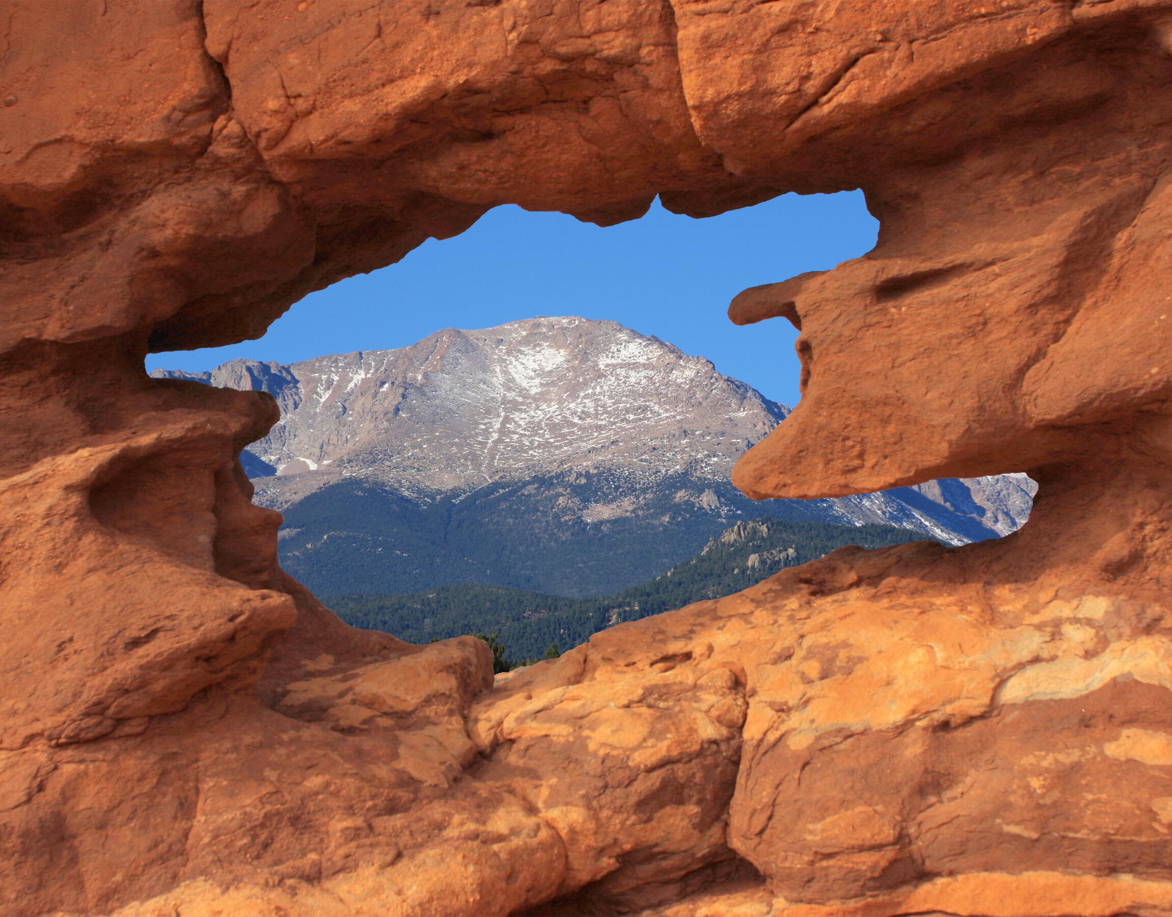 Image of Pikes Peak as seen through the Siamese Twins rock formation.