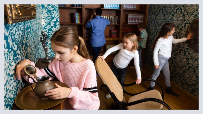 A group of children are shown trying to find their way out of an escape room.