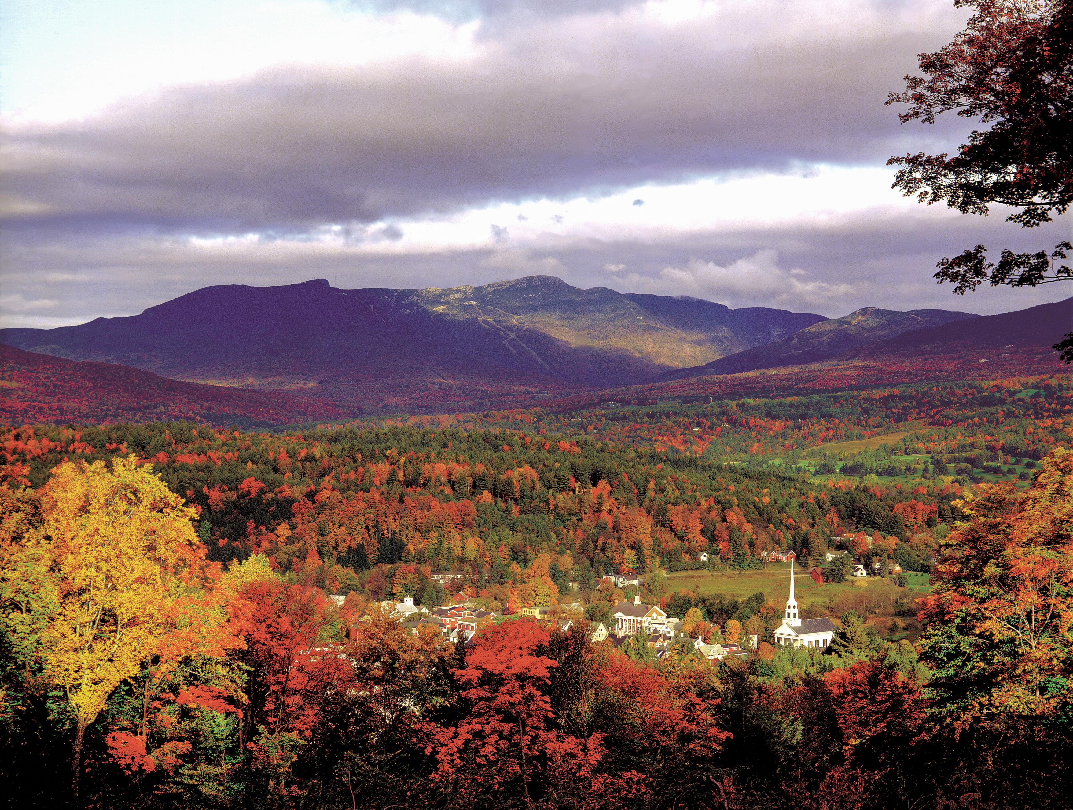 Aerial image of the fall foliage surrounding the town of Stowe, Vermont.