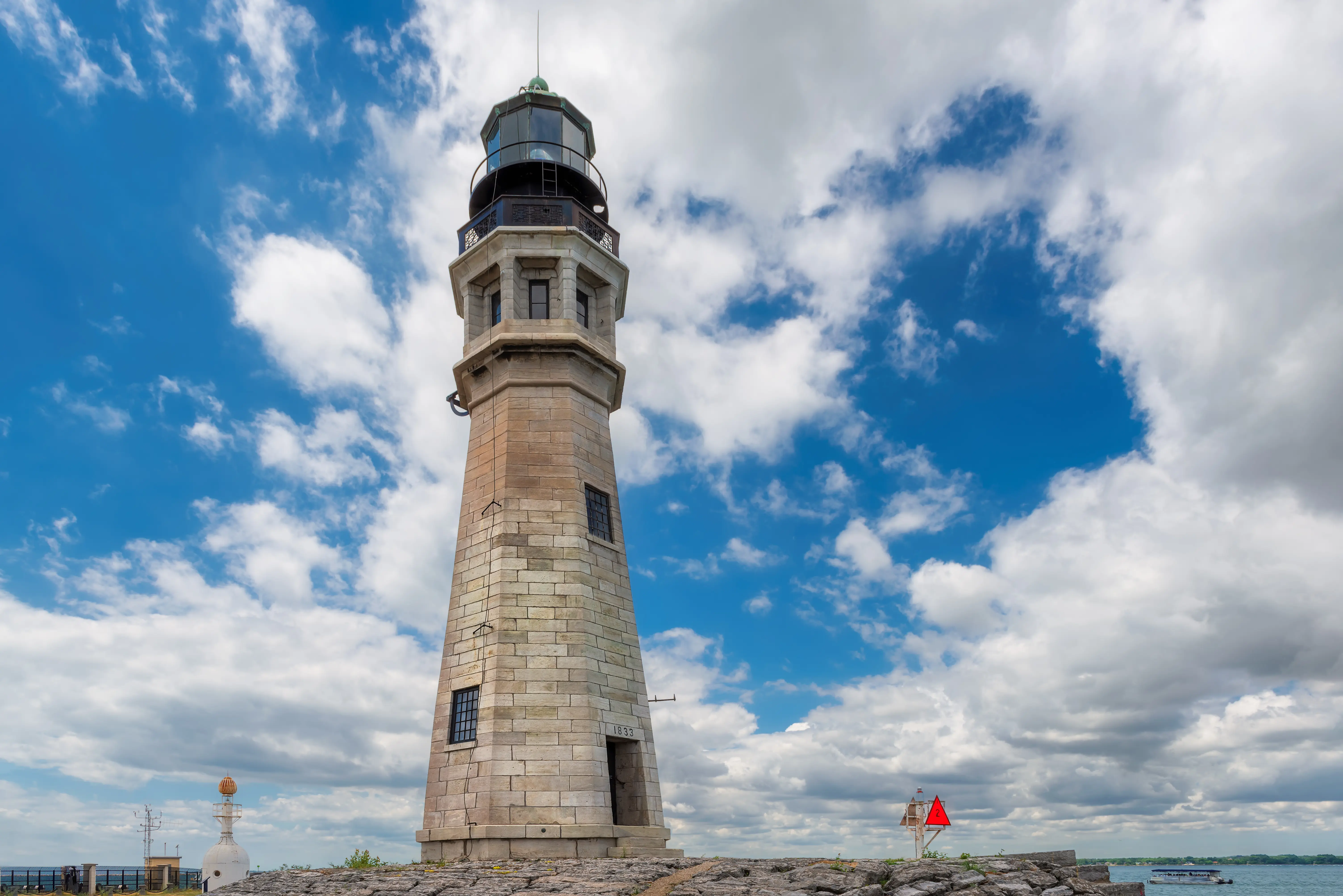 Close-up of Buffalo Lighthouse with blue sky and clouds, located at the mouth of the Buffalo River at the north entrance to Buffalo Harbor