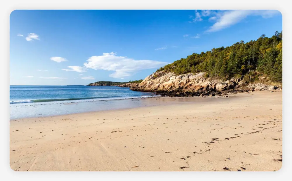 Image of Sand Beach that looks out into the ocean on a sunny day