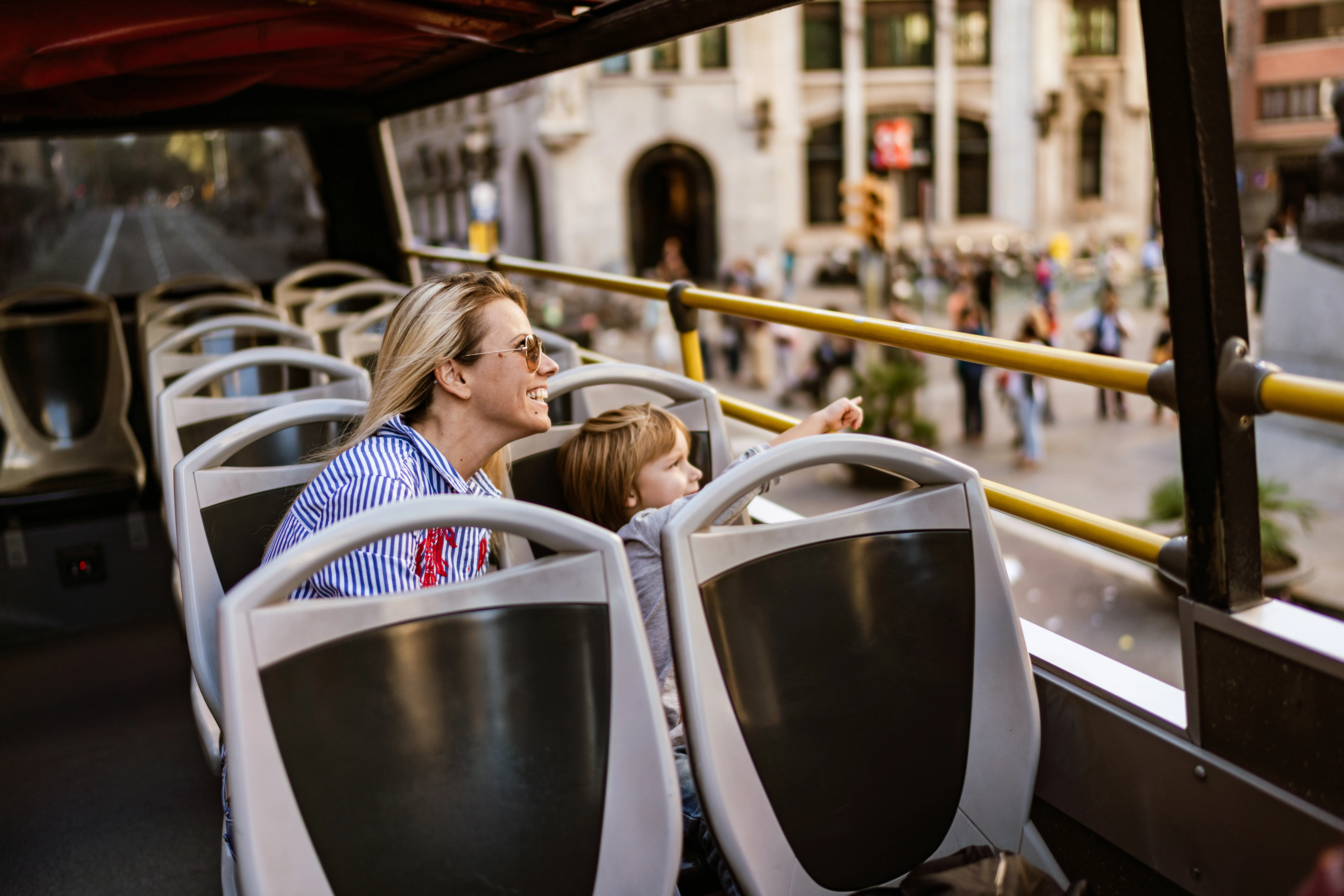 Photo of a woman and boy on a bus tour