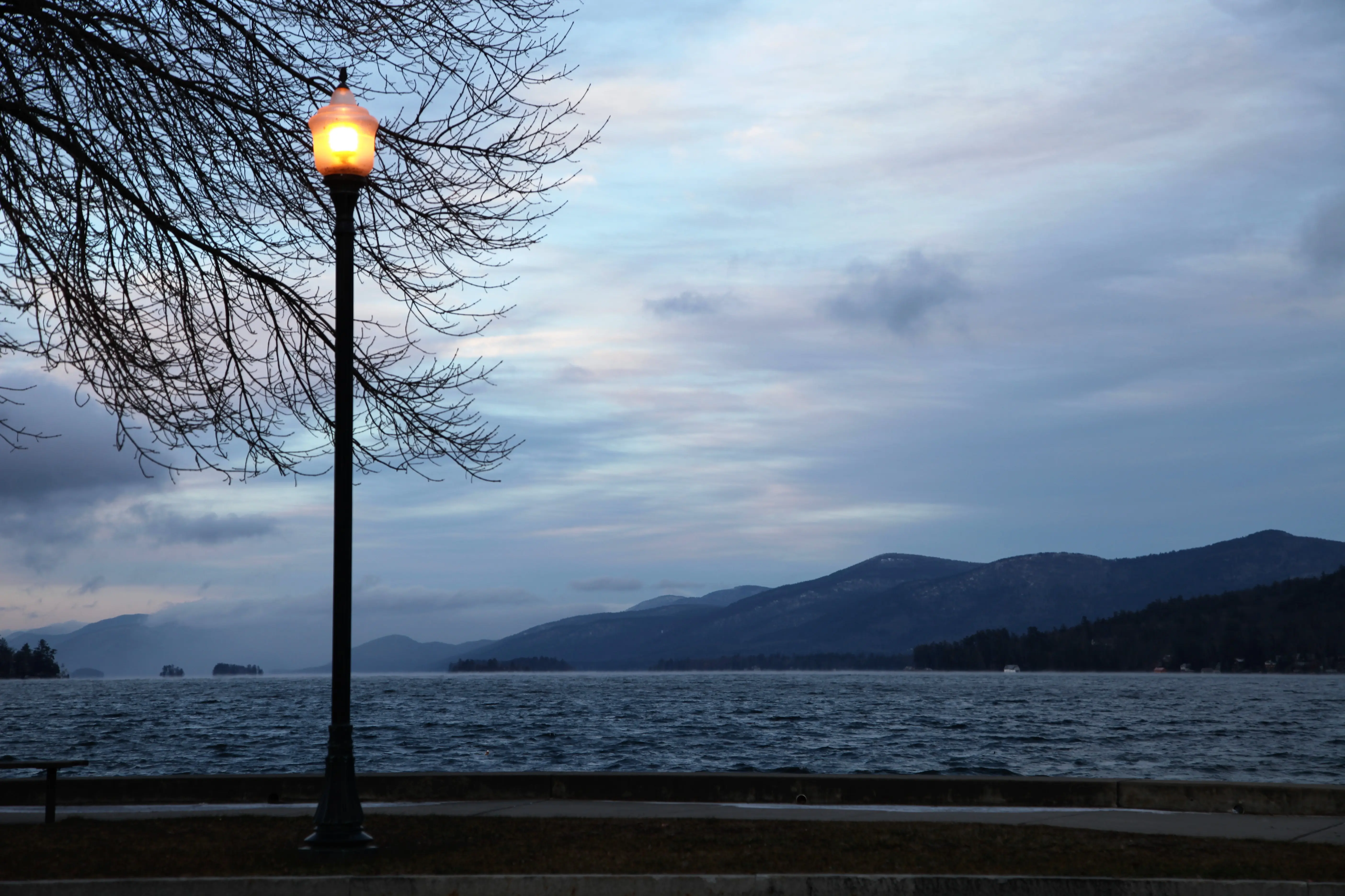 Outdoor shot of Lake George, streetlight in foreground